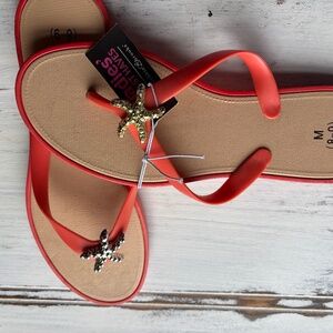 Size 8 NWT Coral sandals with metal starfish detail.